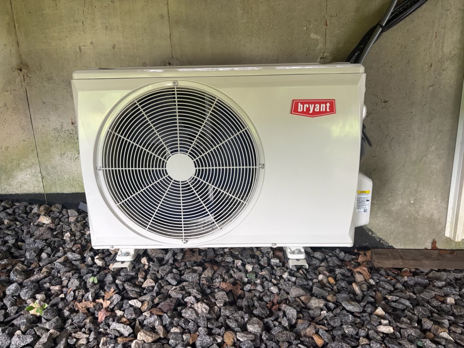 Bryant outdoor condenser unit installed on concrete pad