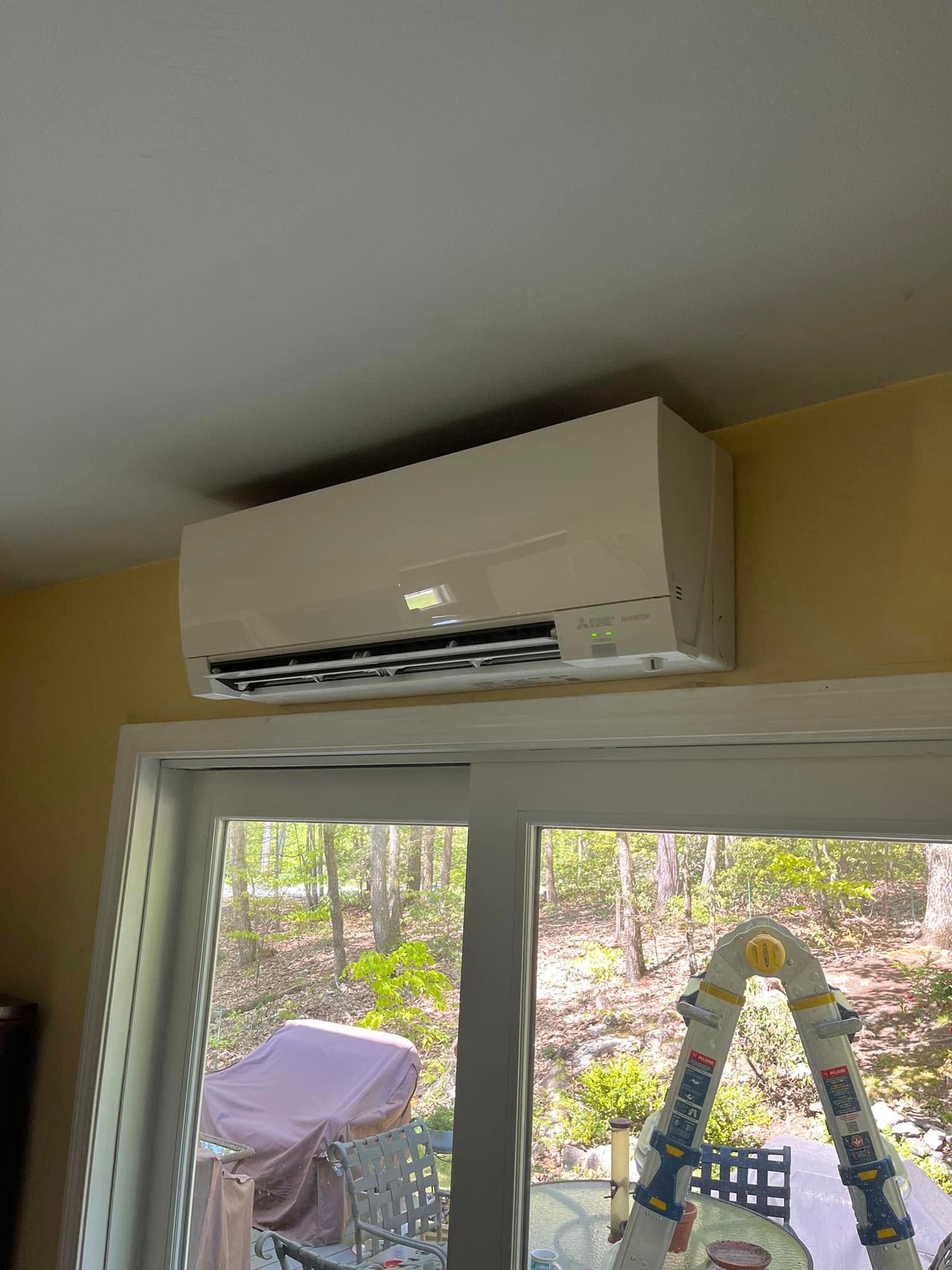Installed mini-split unit above sliding glass doors