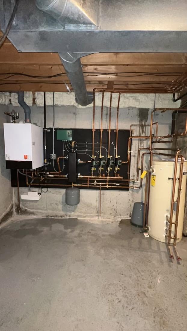 Copper pipe heating system with manifold and boiler in basement