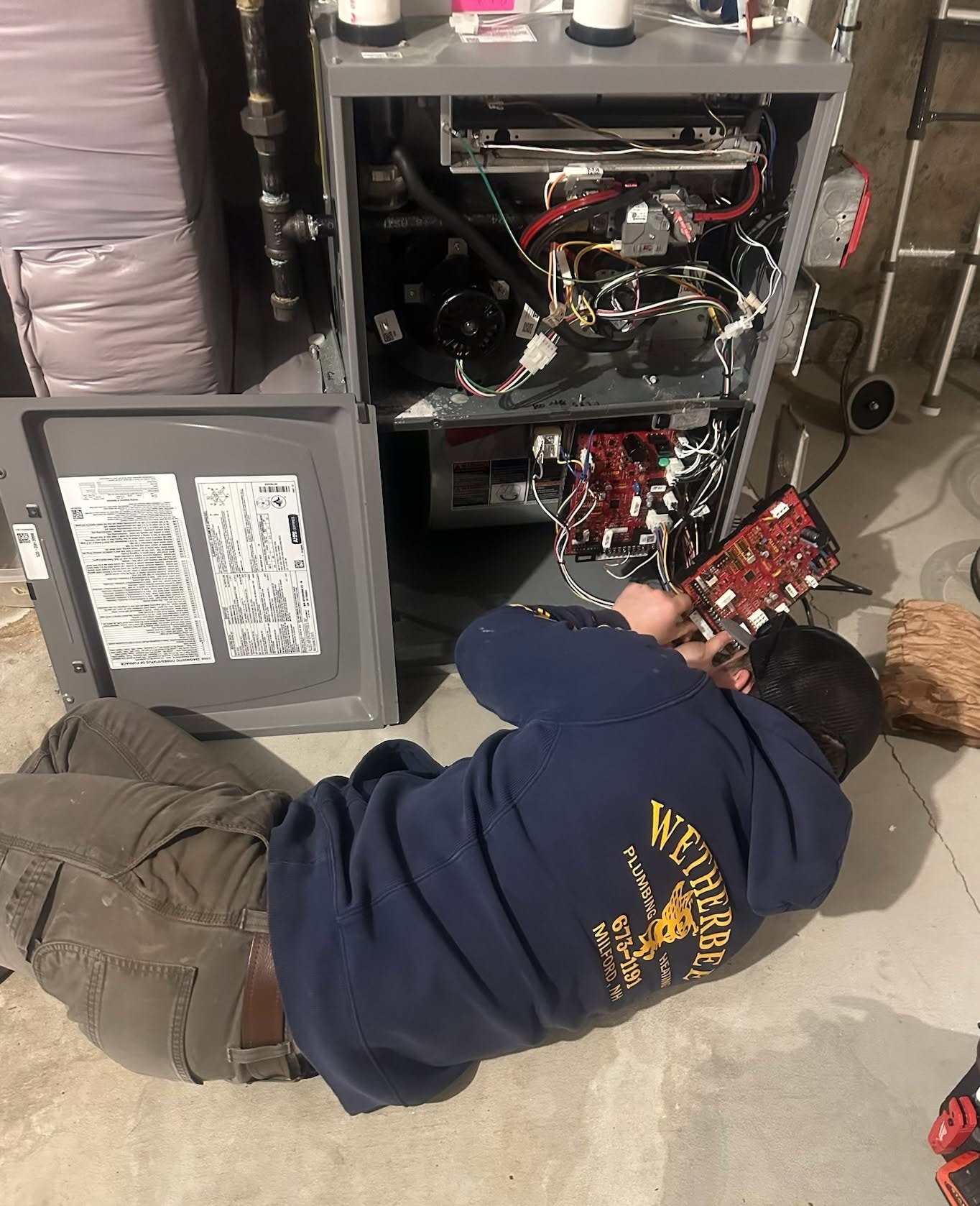 Wetherbee technician servicing a furnace control board