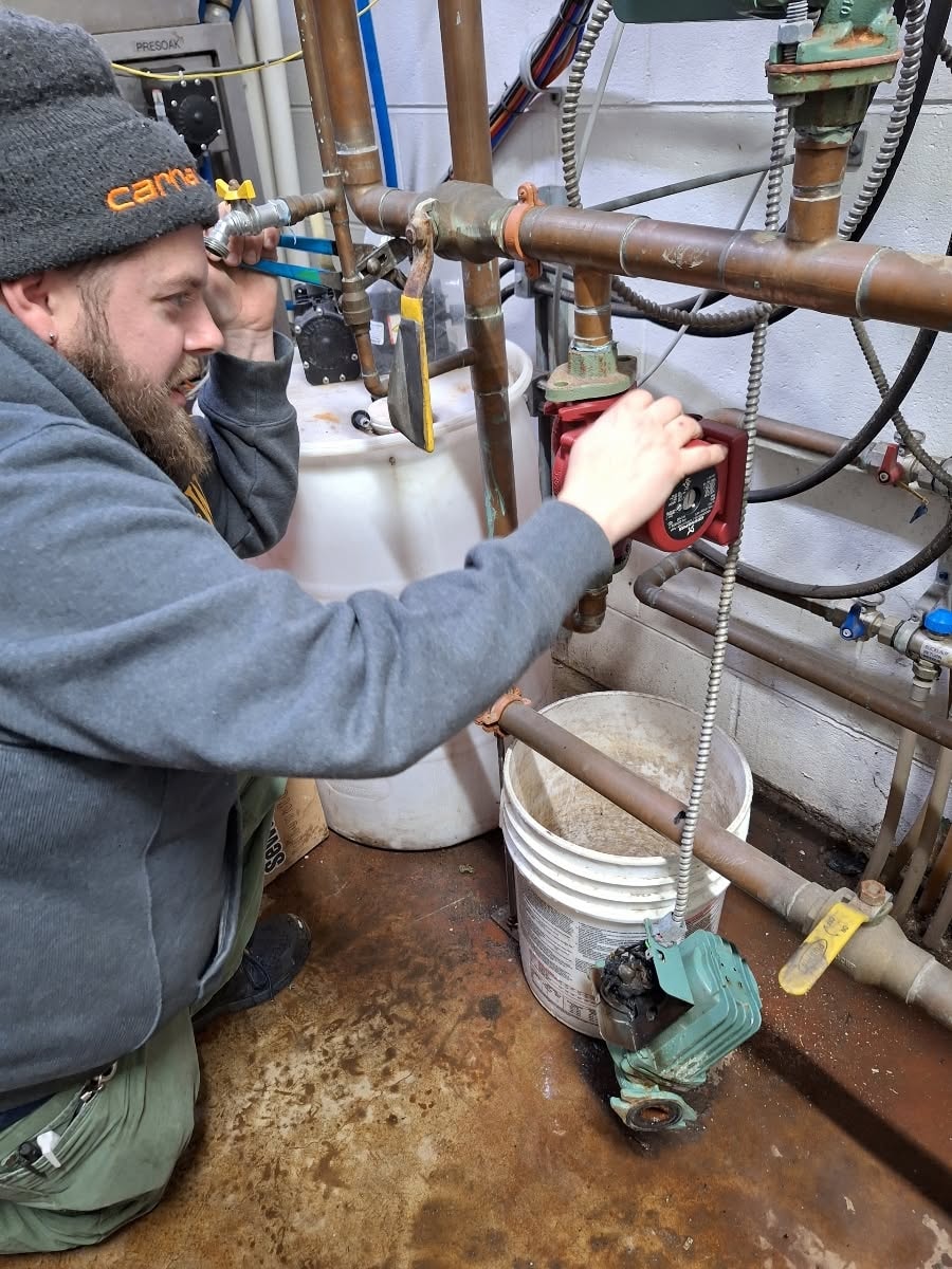 Wetherbee technician servicing copper pipe system
